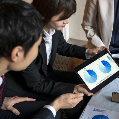 business people working with ipad side view